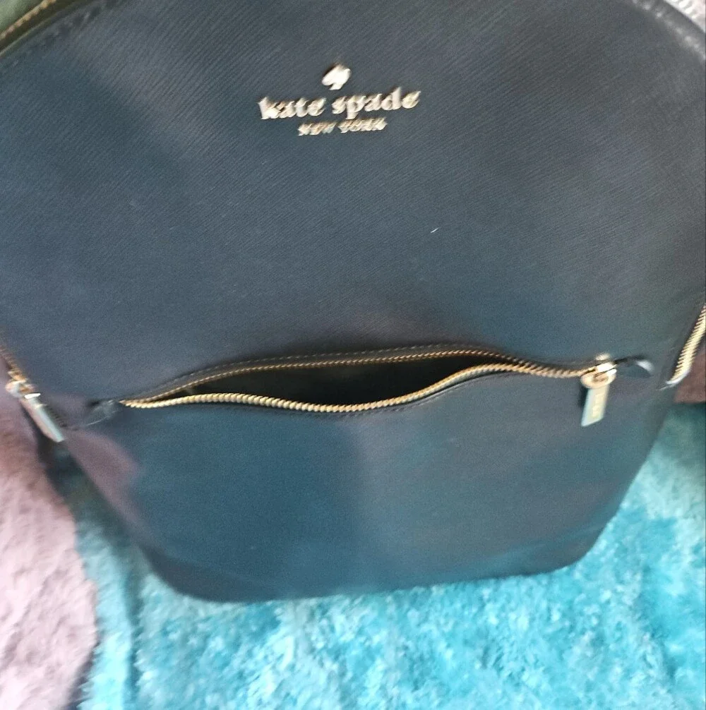 AS-IS Kate Spade black leather backpack LEFT STRAP AT THE TOP TORN. STILL NEW